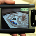 THE INVISIBLE TRAIN: A COLLABORATIVE HANDHELD AUGMENTED REALITY DEMONSTRATOR