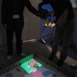 CoGAME: Manipulation Using a Handheld Projector