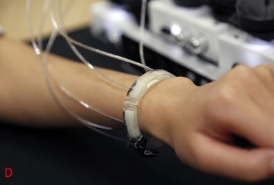 Submerged Haptics: A 3-DOF Fingertip Haptic Display using Miniat