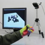 Real-time hand-tracking with a color glove