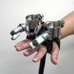 SomatoShift: A Wearable Haptic Display for Somatomotor Reconfiguration via Modifying Acceleration of Body Movement
