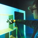 An effective combination of haptic and tactile sensations in human-scale virtual environments