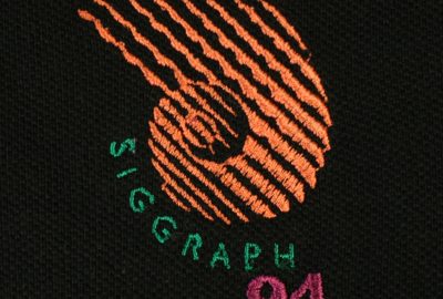 1994-SIGGRAPH-Black-Polo-Conference-Committee-Logo